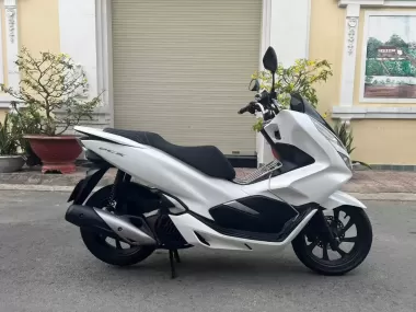 Honda PCX motorbike in white, black, red