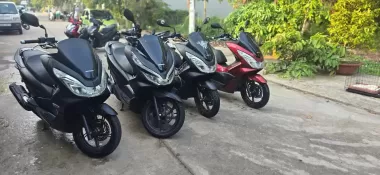 Honda PCX motorbike in white, black, red