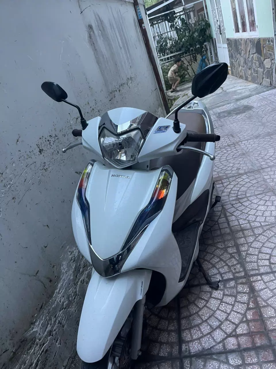 White Honda Lead motorbike