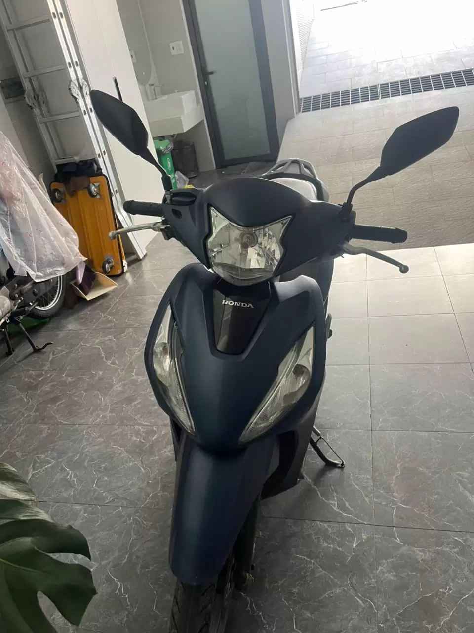 Blue Honda Vision motorbike