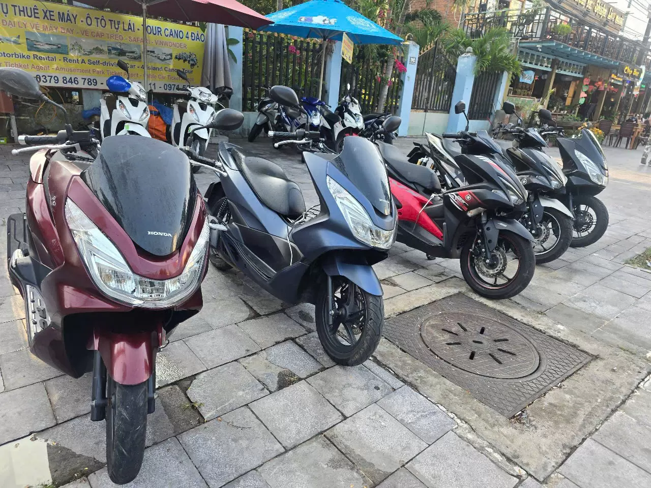 Honda PCX motorbike black, red, blue