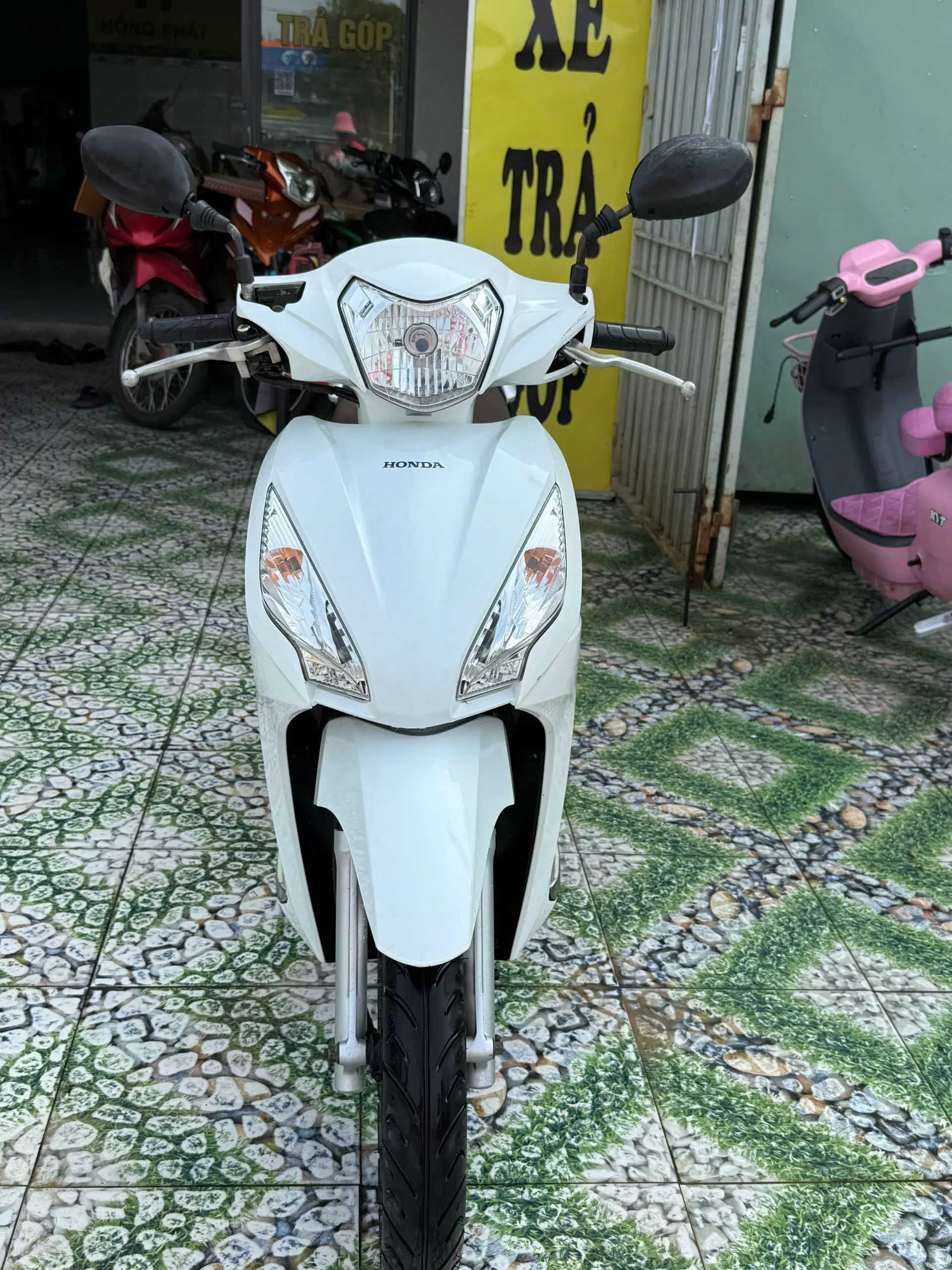Honda Vision motorbike white, red