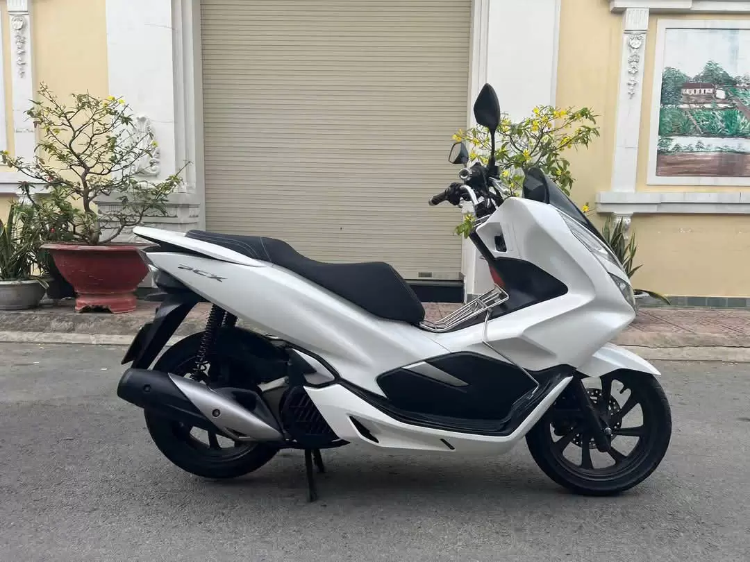 Honda PCX motorbike in white, black, red