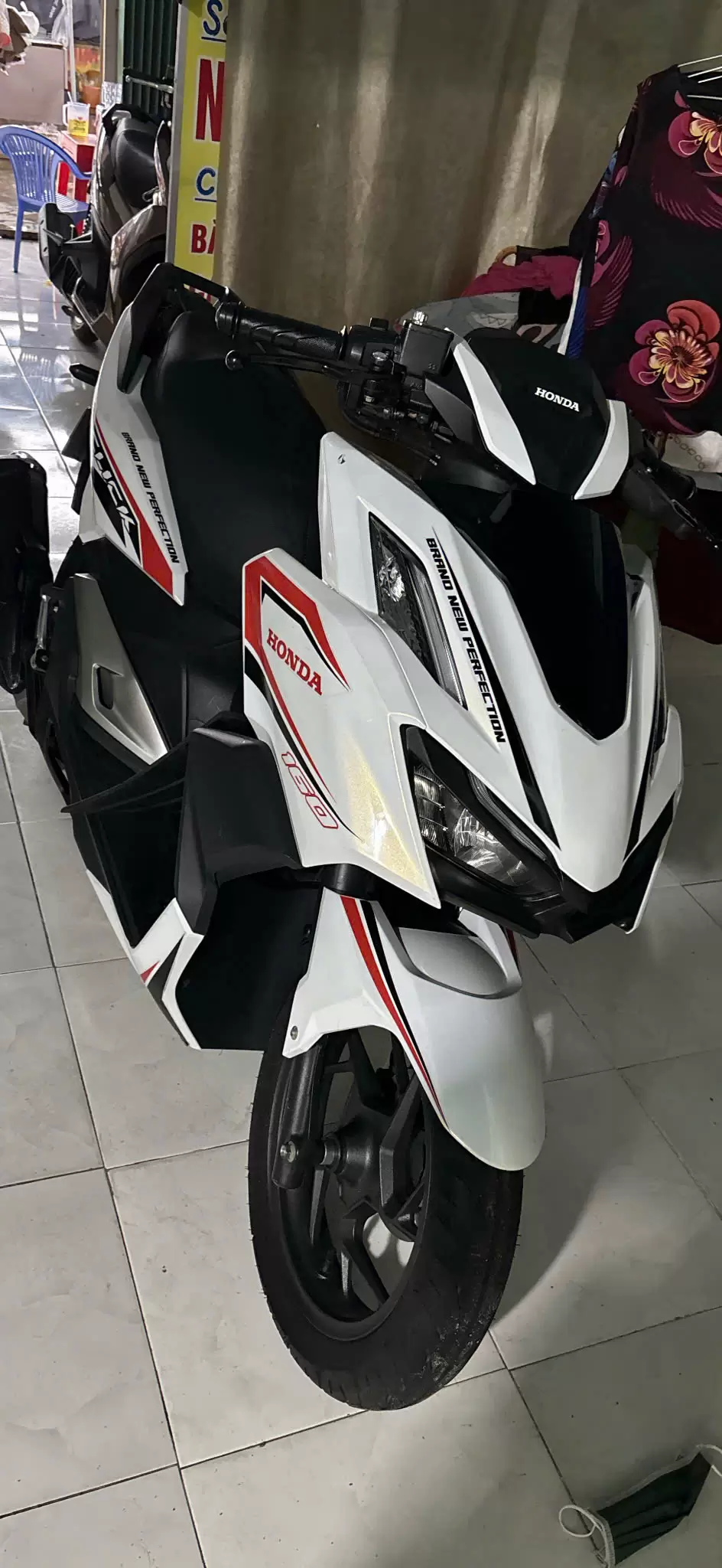 White Honda 160 motorbike