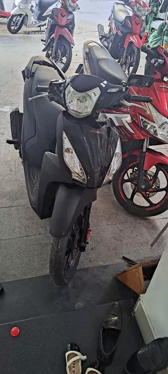Honda Vision dark blue motorbike